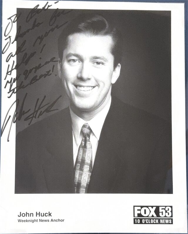 Signed photograph of Fox 53 weeknight news anchor John Huck, inscribed to Empire Investigation